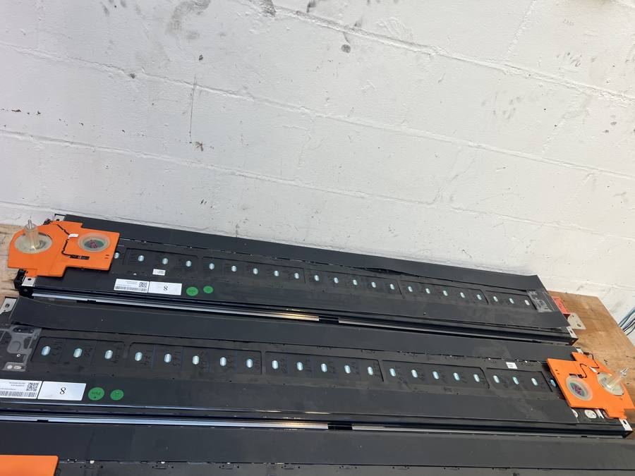 Long modules marked with cell readings and green pass stickers
